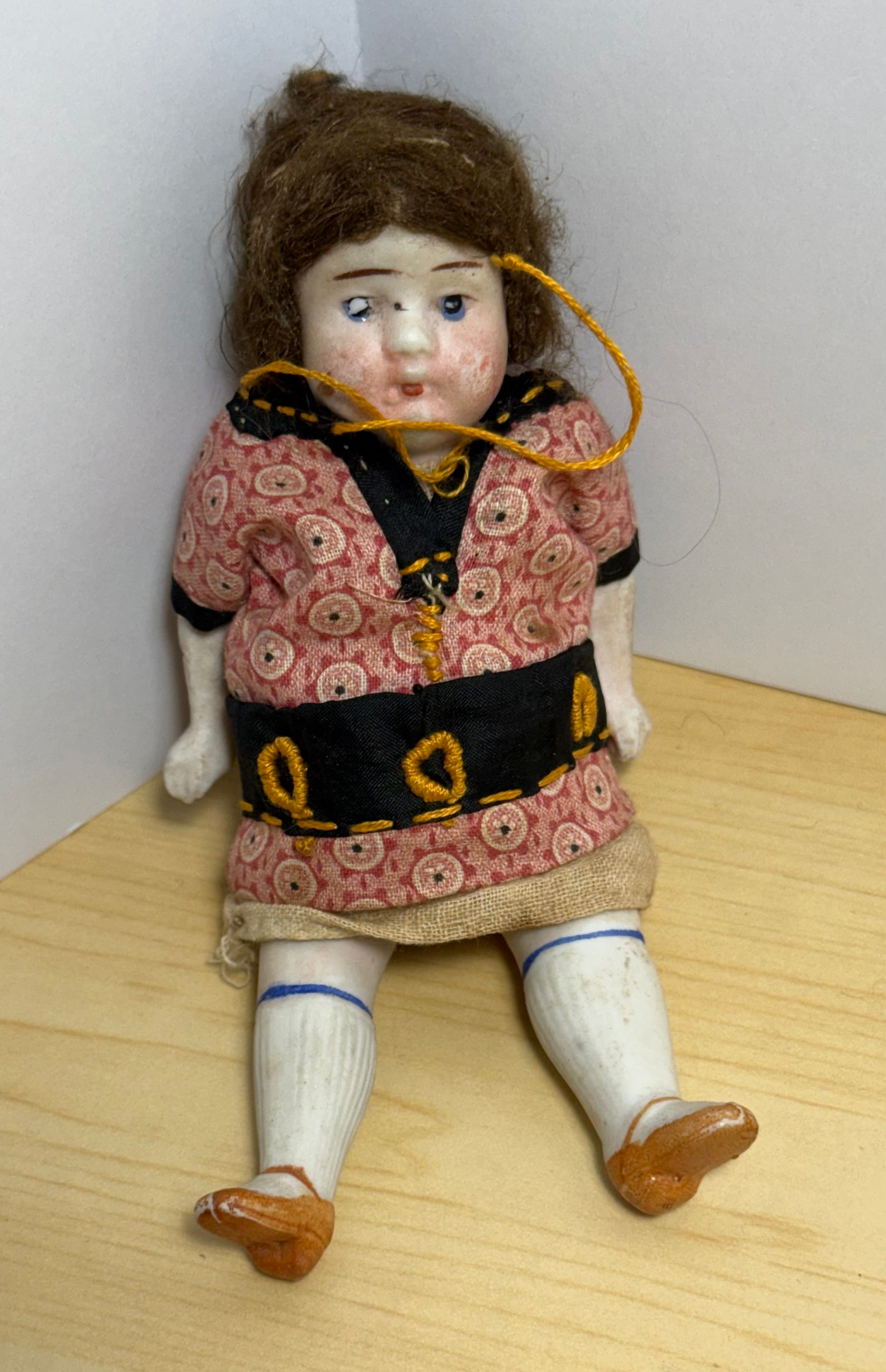 Antique Bisque Porcelain Jointed Doll Painted Blue Socks Original Cloth Dress