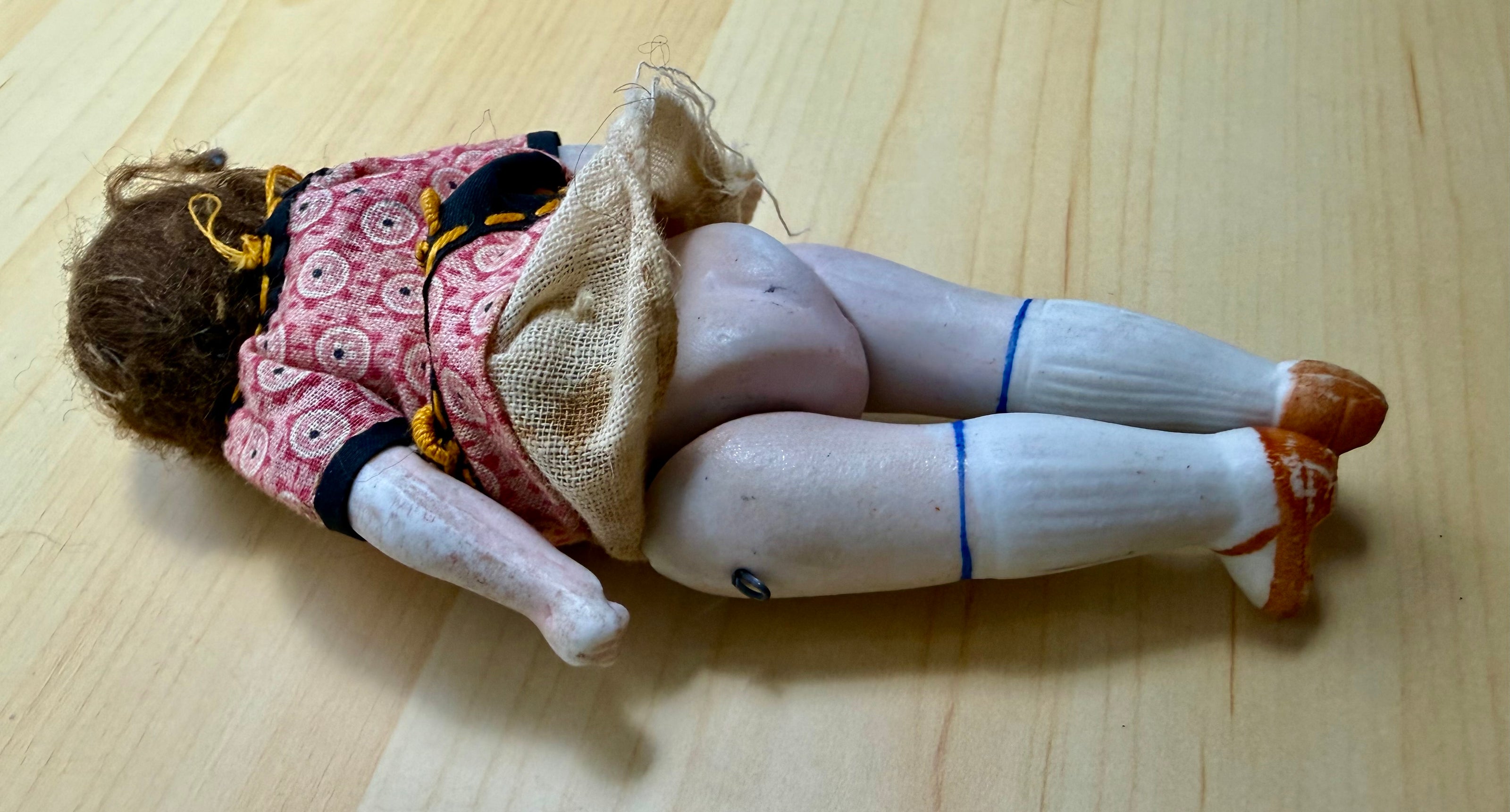 Antique Bisque Porcelain Jointed Doll Painted Blue Socks Original Cloth Dress