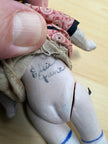 Antique Bisque Porcelain Jointed Doll Painted Blue Socks Original Cloth Dress