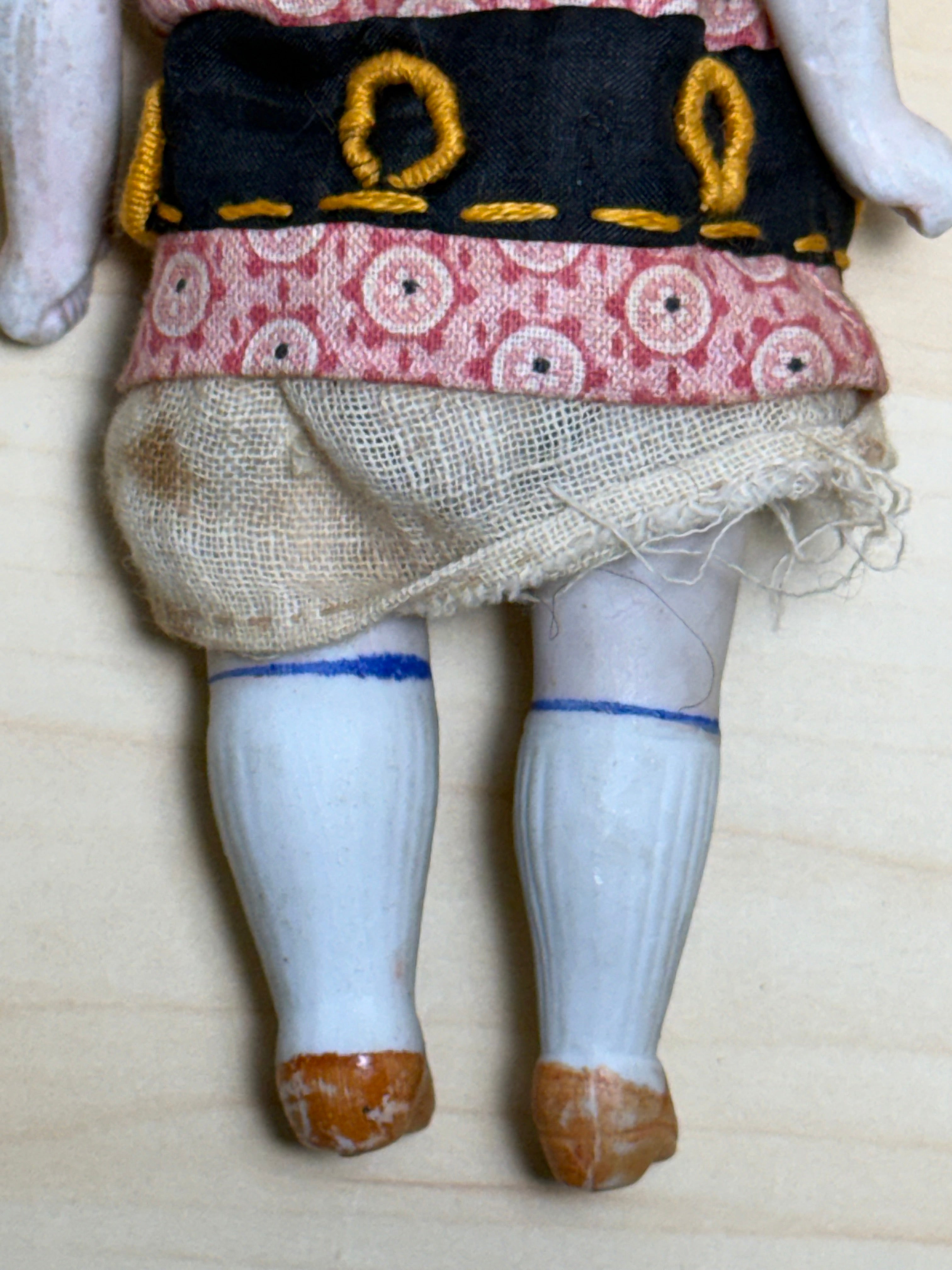Antique Bisque Porcelain Jointed Doll Painted Blue Socks Original Cloth Dress